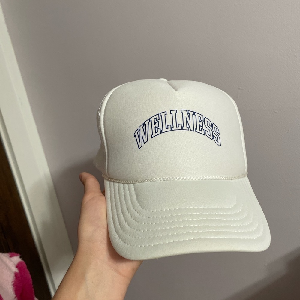 Urban outfitters wellness trucker hat